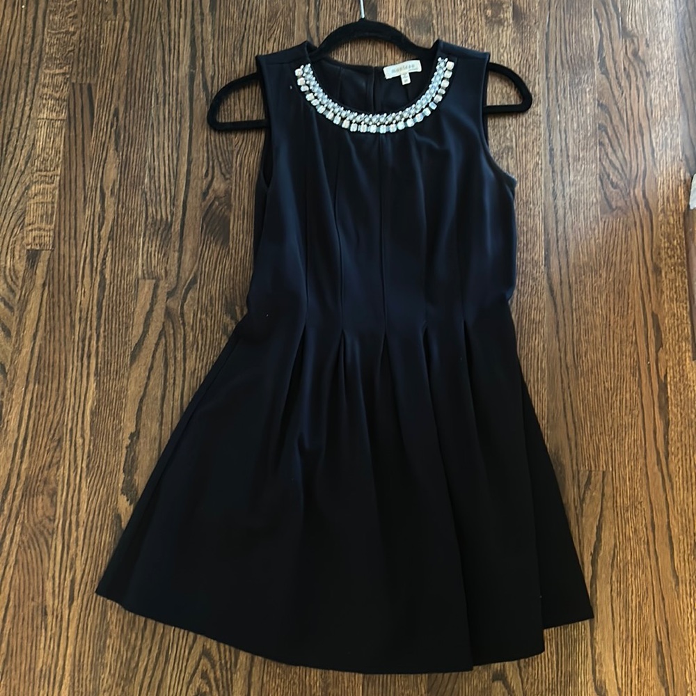 Black cocktail dress with jeweled neck detail